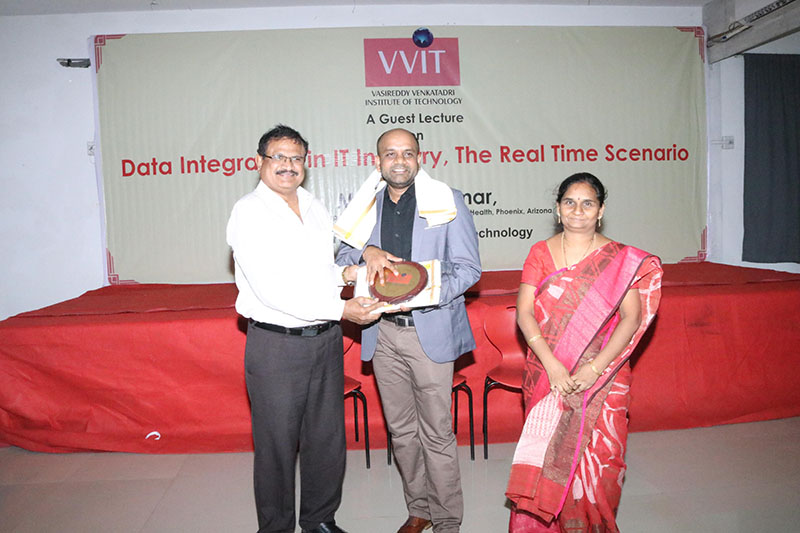 Principal felicitating Sivakumar Talluri