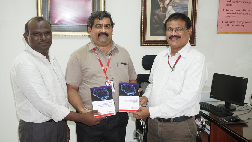 Principal Dr.Y.Mallikarjuna Reddy, ECE HOD Dr.K.Giribabu congratulating Dr.M.Y.Bhanumurthy